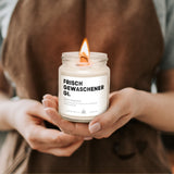 a person holding a candle in their hands