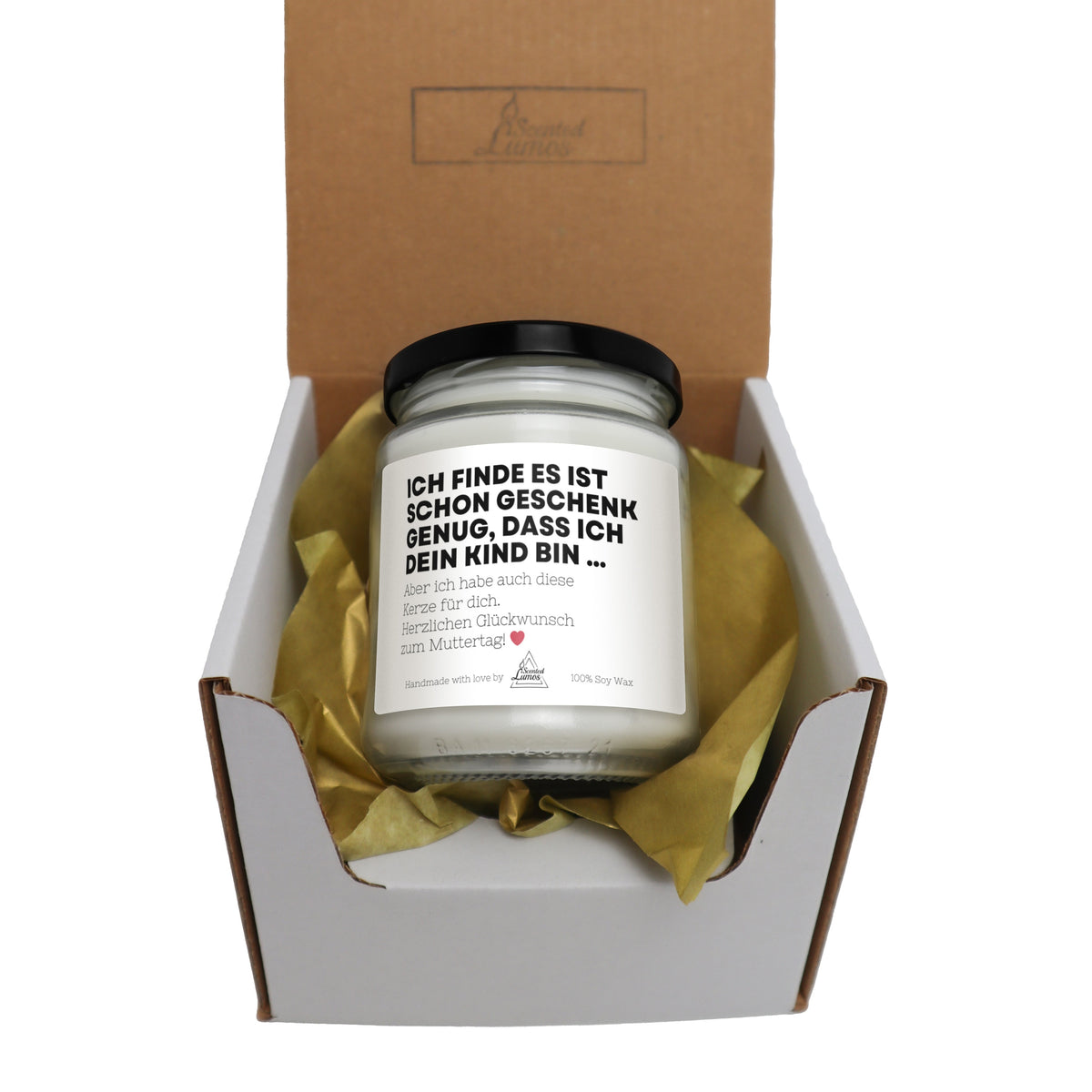 a candle in a box with a card inside