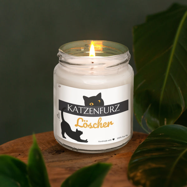 a lit candle sitting on top of a wooden table