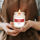 a person holding a candle in their hands