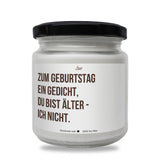 a white jar with a black lid on a white background