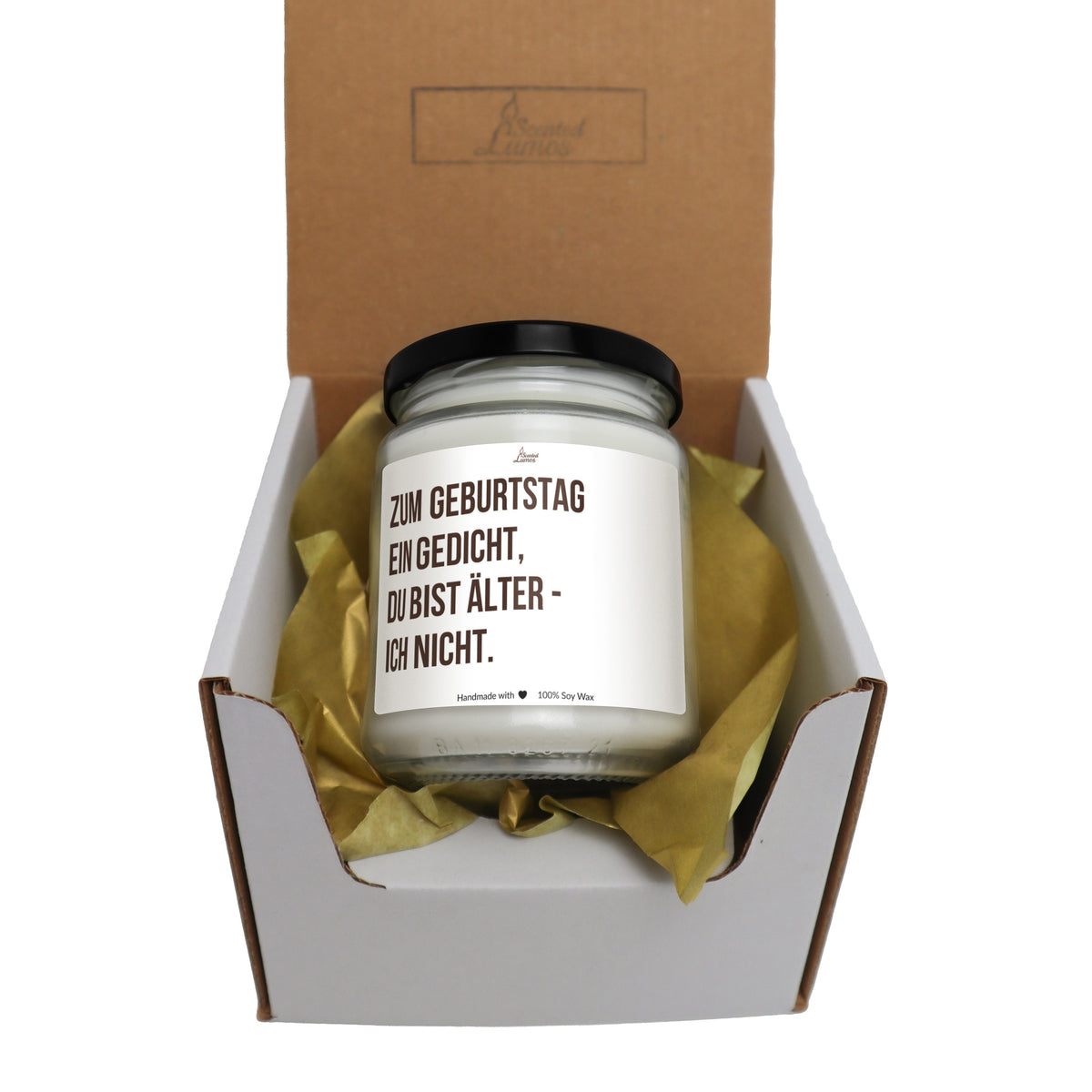 a candle in a box with a brown ribbon around it