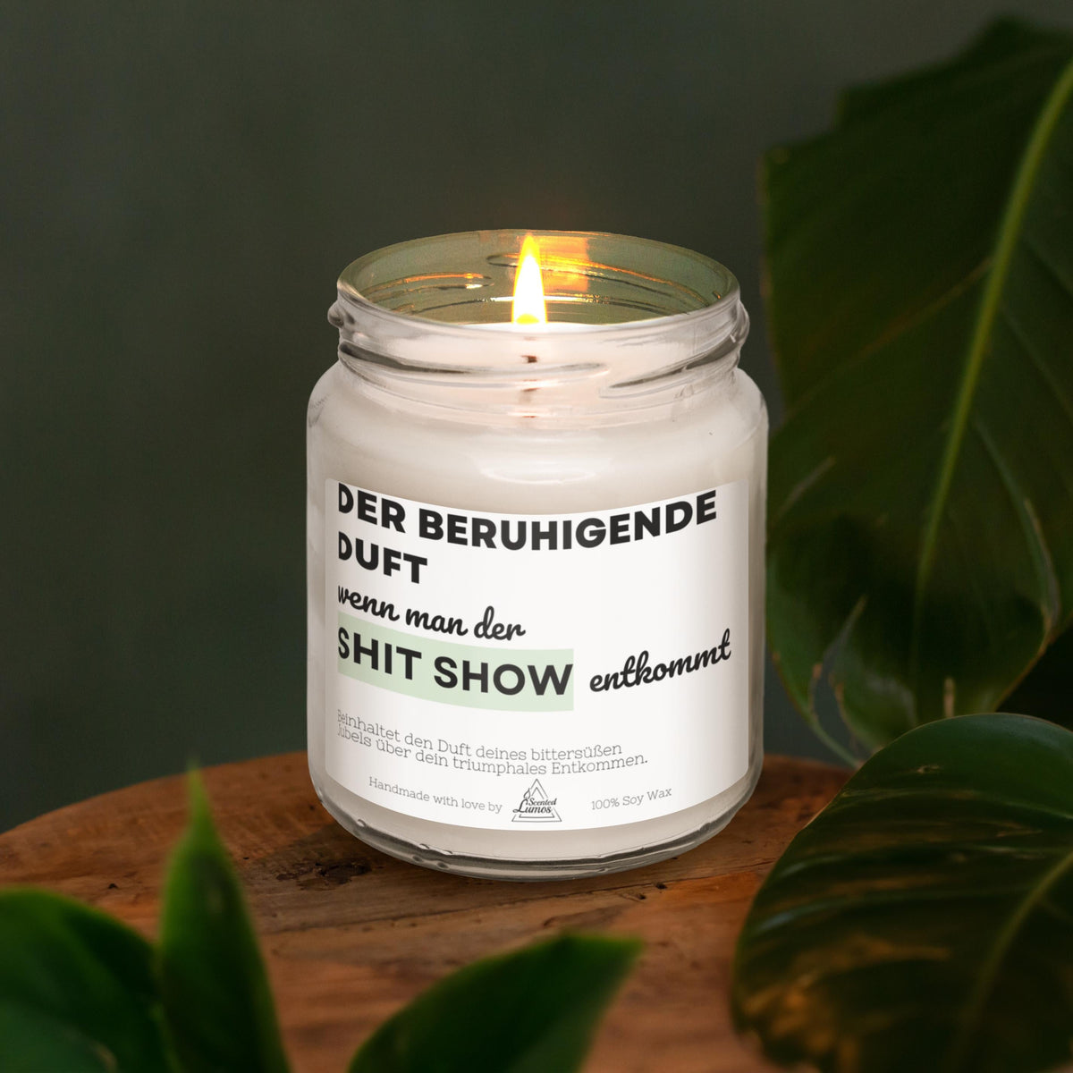 a white candle sitting on top of a wooden table