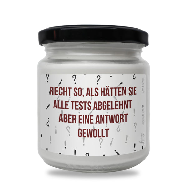 a white jar with a red and black label on it