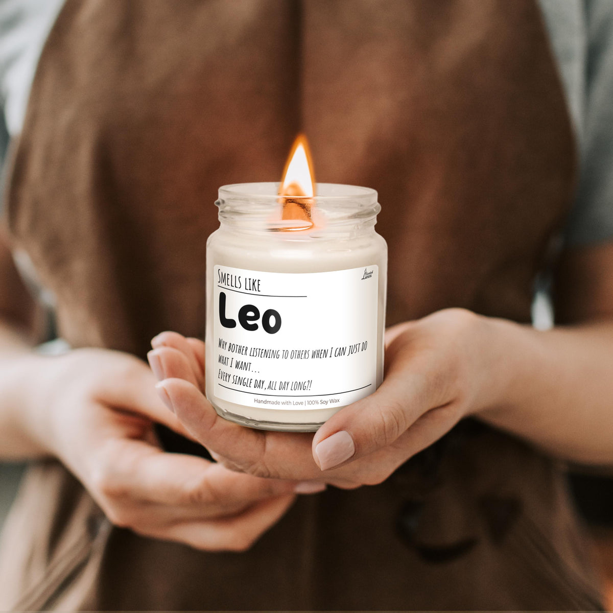 a person holding a candle in their hands