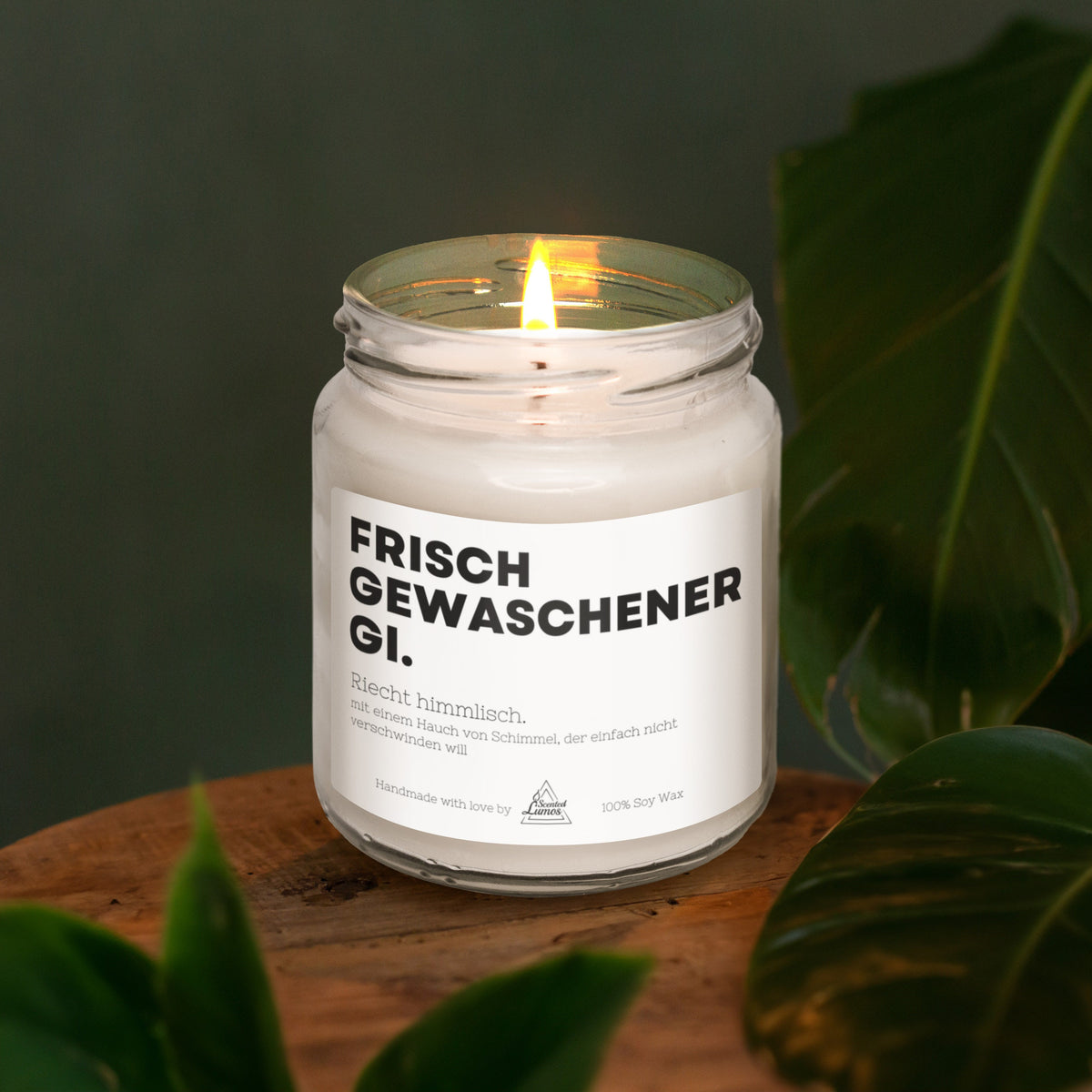 a candle is sitting on a wooden table