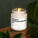 a candle is sitting on a wooden table