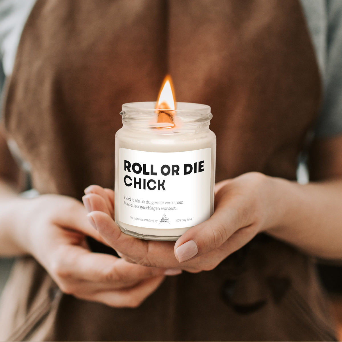 a person holding a candle in their hands