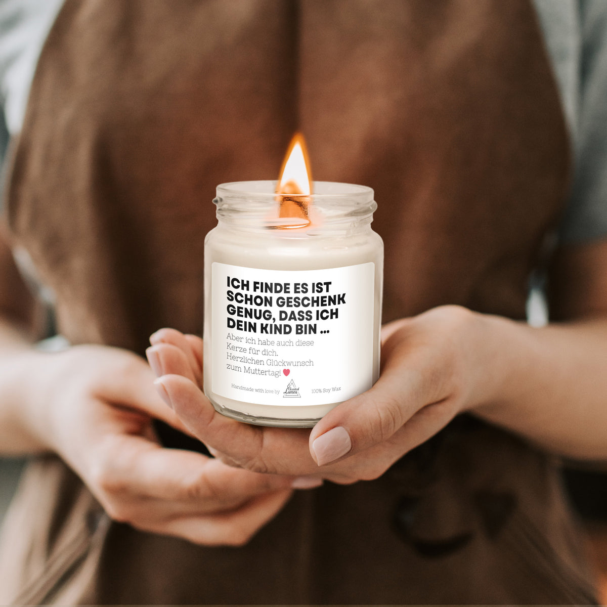 a person holding a candle in their hands