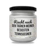 a jar of white paint with a black lid