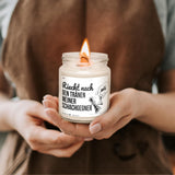 a person holding a candle in their hands