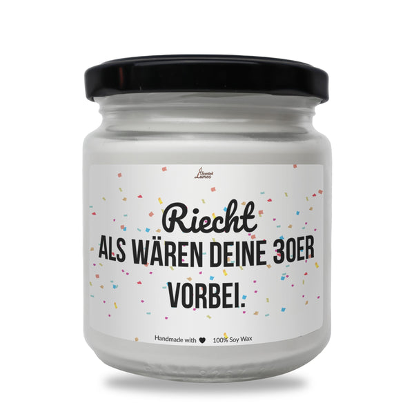 a white jar with a black lid and a black lid