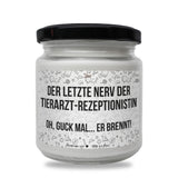 a white jar with a black lid on a white background