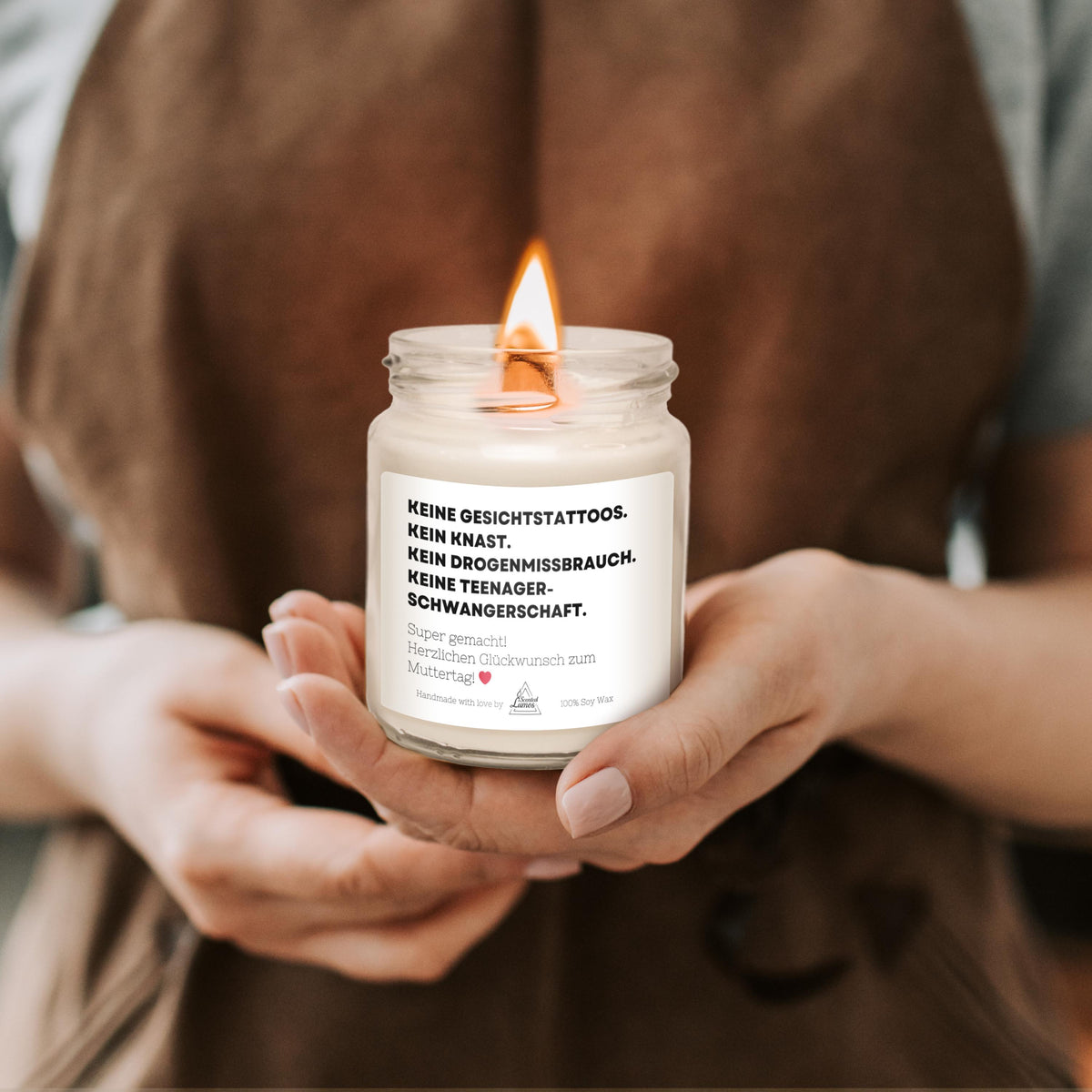 a person holding a candle in their hands