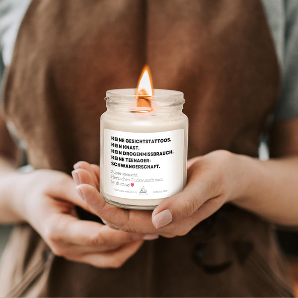 a person holding a candle in their hands