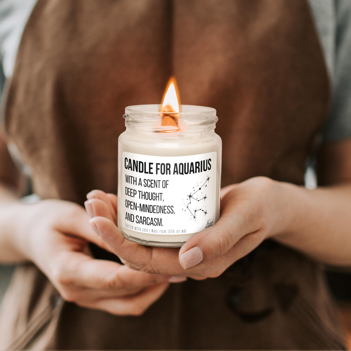 a person holding a candle in their hands