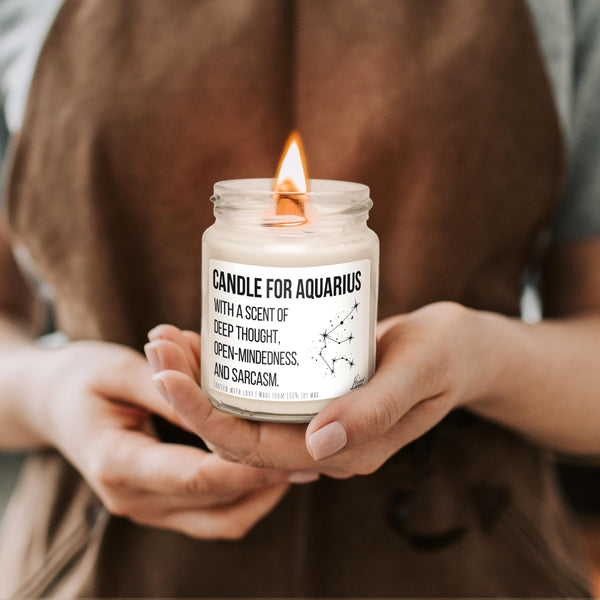 a person holding a candle in their hands