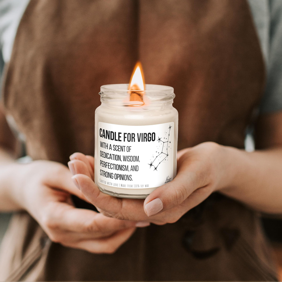 a person holding a candle in their hands