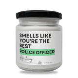 a white jar with a black lid that says smells like you're the best