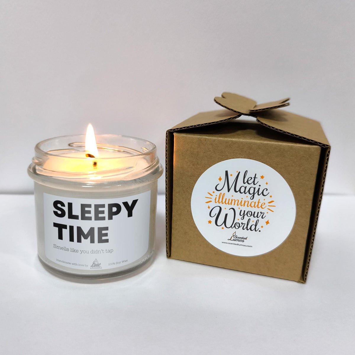 a candle that is sitting next to a box