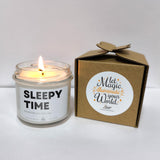 a candle that is sitting next to a box