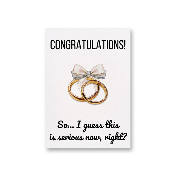 a card with two gold rings and a bow on it
