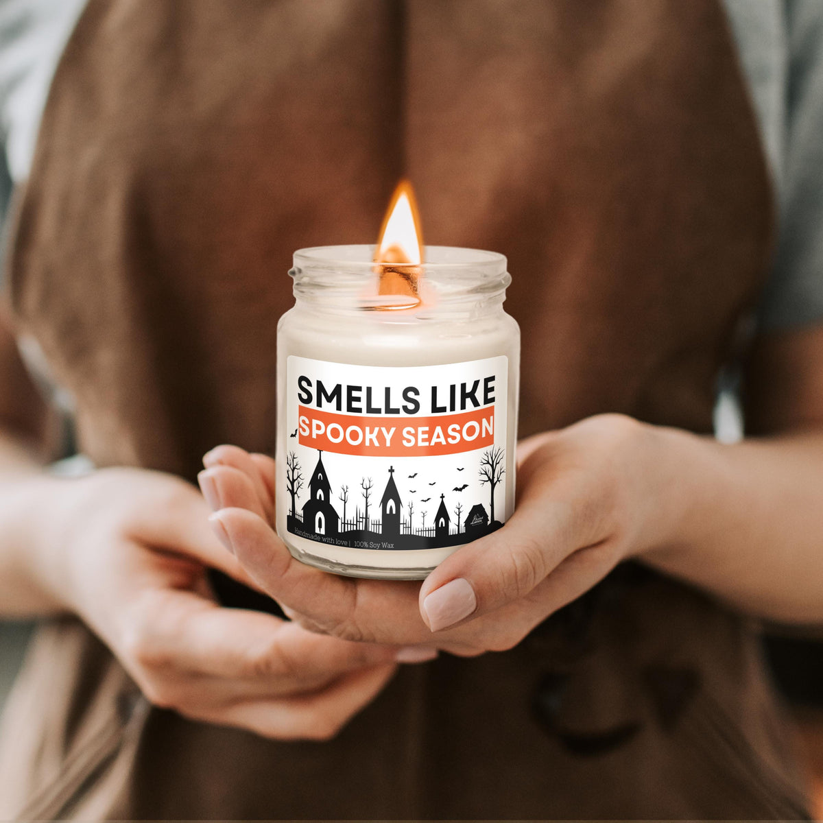 a person holding a candle in their hands