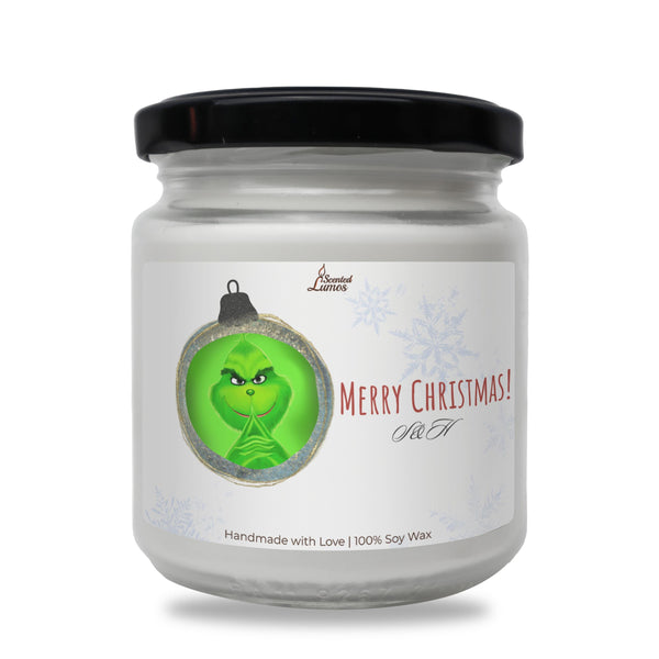 a jar of merry christmas candles with an ornament