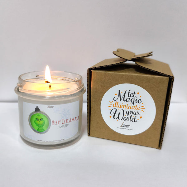 a white candle sitting next to a brown box