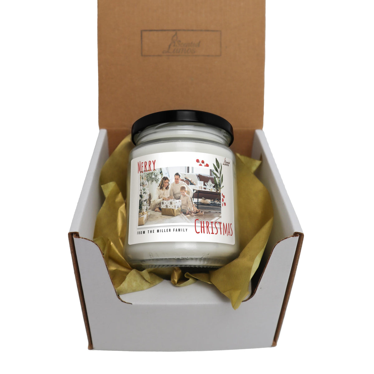 a candle in a box with a ribbon around it