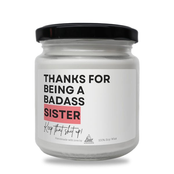 a white jar with a black lid that says thanks for being a badass sister