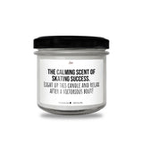 a white candle with a black lid that says, the calming scent of skin -