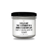 a jar of white candles with a black lid