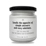 a white jar with a black lid that says smells the opposite of simple answers and