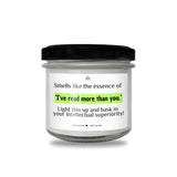 a jar of white candles with a black lid
