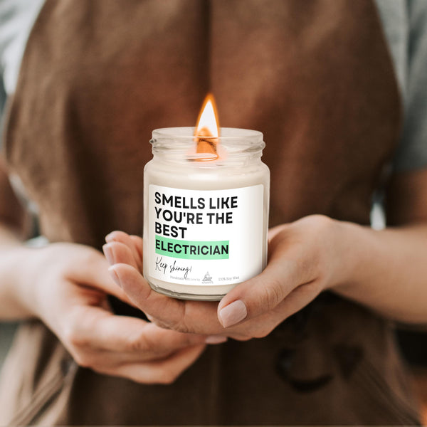 a person holding a candle in their hands