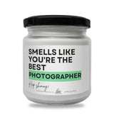 a white jar with a black lid that says smells like you're the best