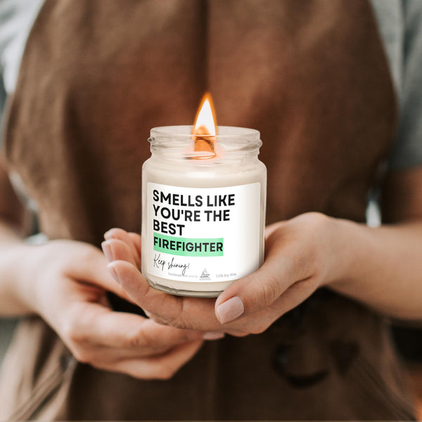 a person holding a candle in their hands