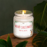 a white candle sitting on top of a wooden table