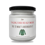 a white jar with a green turtle on it