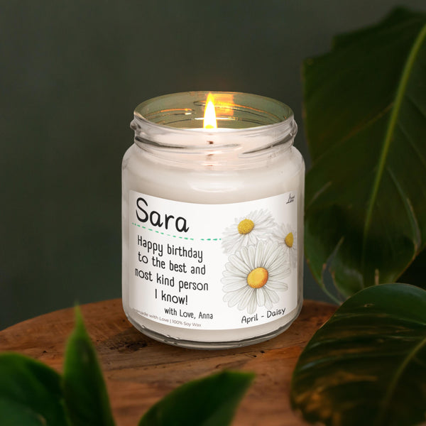 a white candle sitting on top of a wooden table