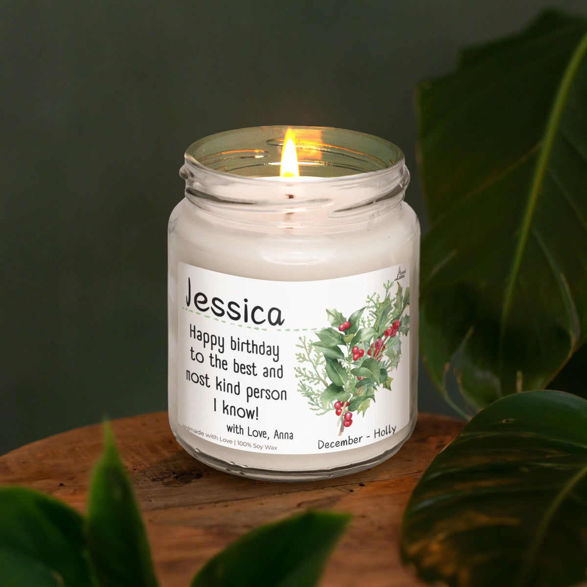 a white candle sitting on top of a wooden table