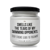 a white jar with a black lid that says smells like the tears of my swimming