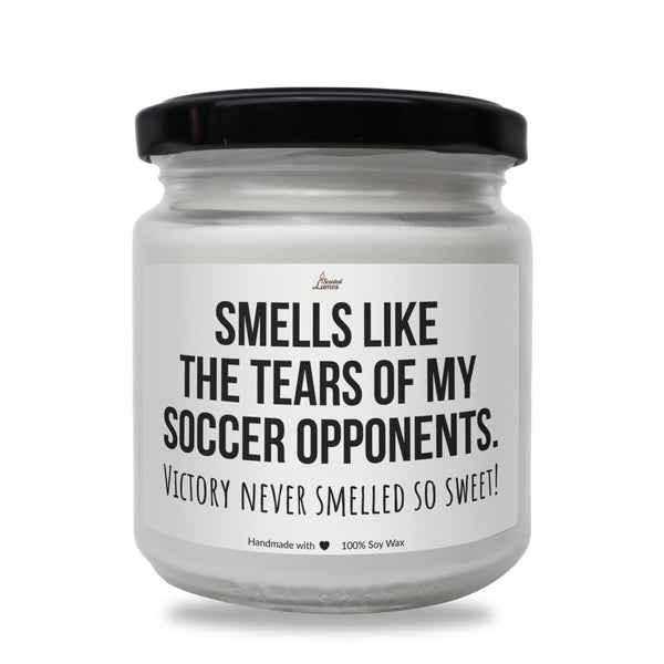 a white jar with a black lid that says smells like the tears of my soccer