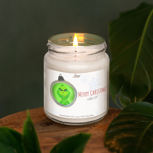 a lit candle sitting on top of a wooden table