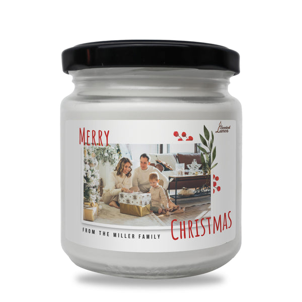 a christmas candle with a family picture on it