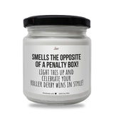 a white jar with a black lid that says smells the opposite of a penalty box