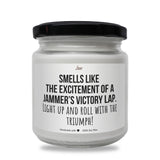 a white jar with a black lid that says smells like the excitement of a jam