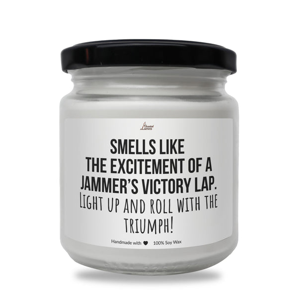 a white jar with a black lid that says smells like the excitement of a jam