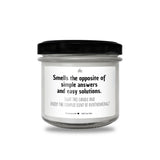 a jar of white candles with a black lid